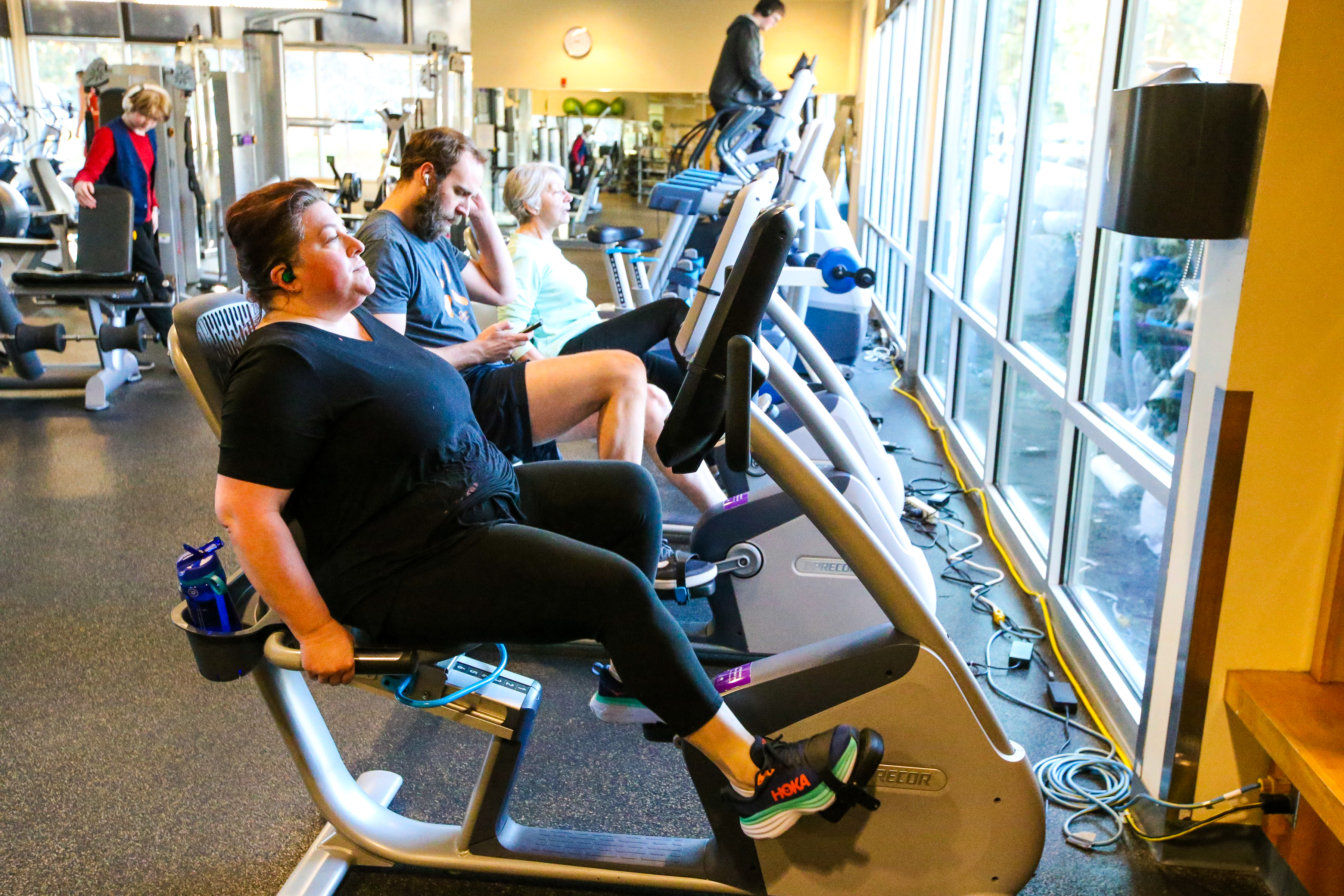 A group of Juniper patrons using the excercise bikes at the fitness center