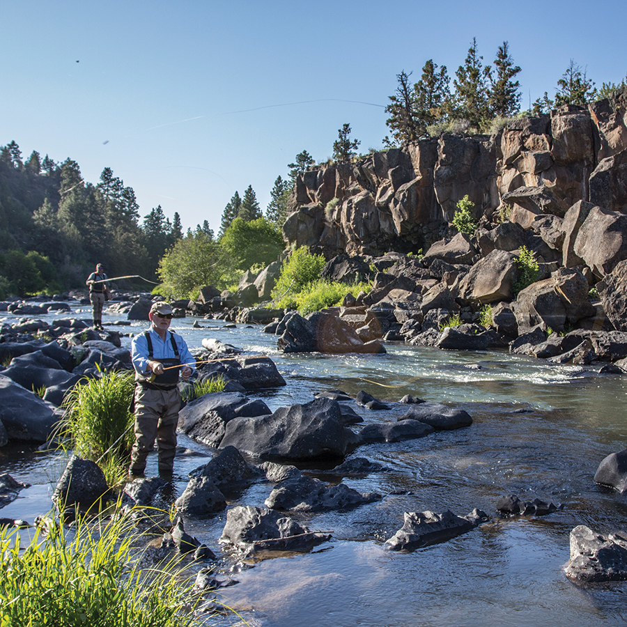 Bend residents fly fishing the Deschutes River in Sawyer Park.