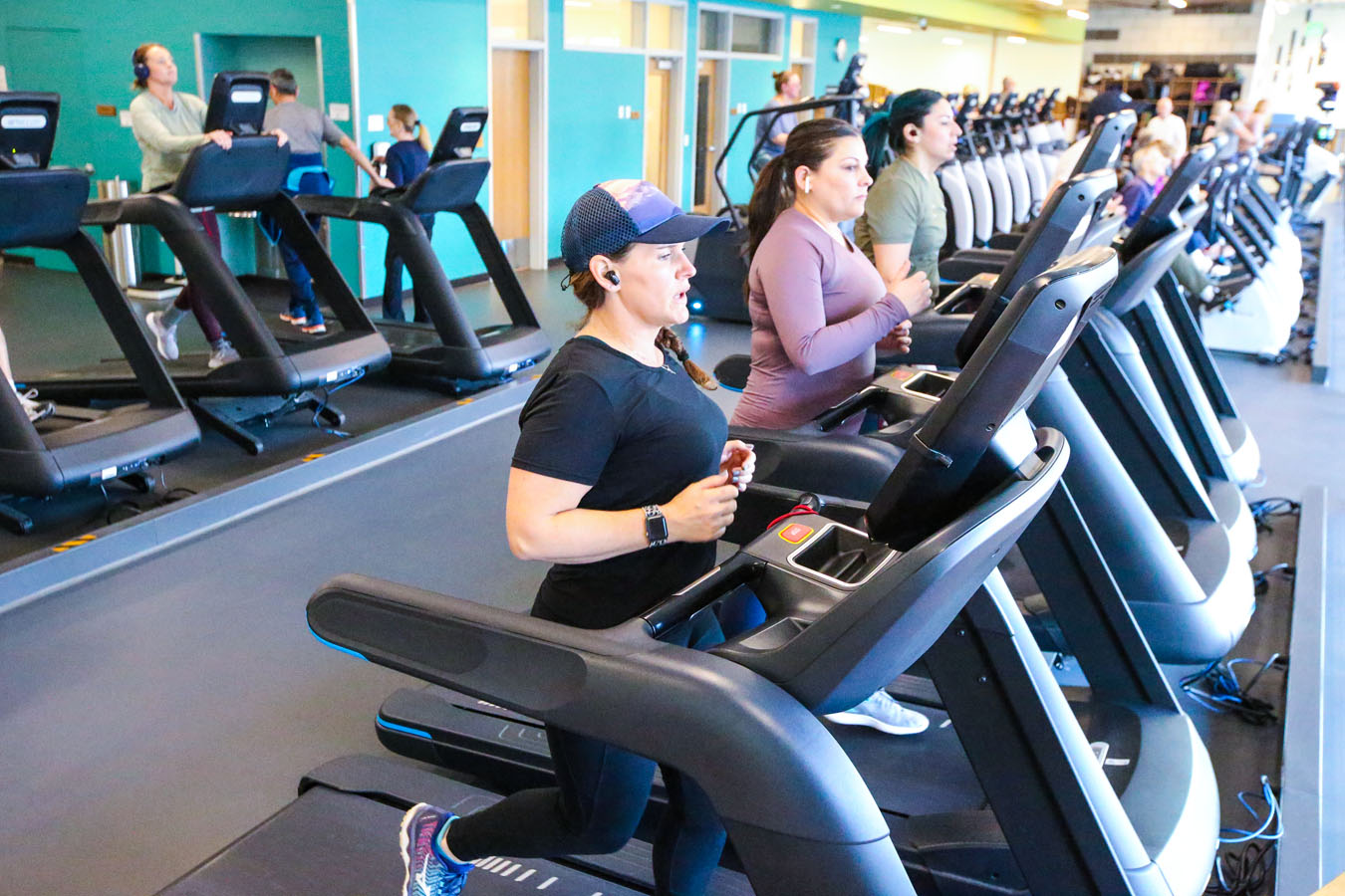 Photo of several patrons on the running machines at Larkspur.