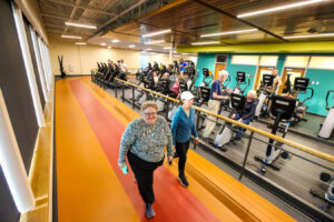 Two patrons enjoying the indoor track at Juniper.