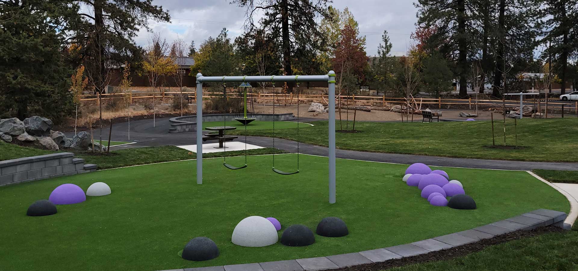 Photograph of a swing set at Liuttle Fawn Park.