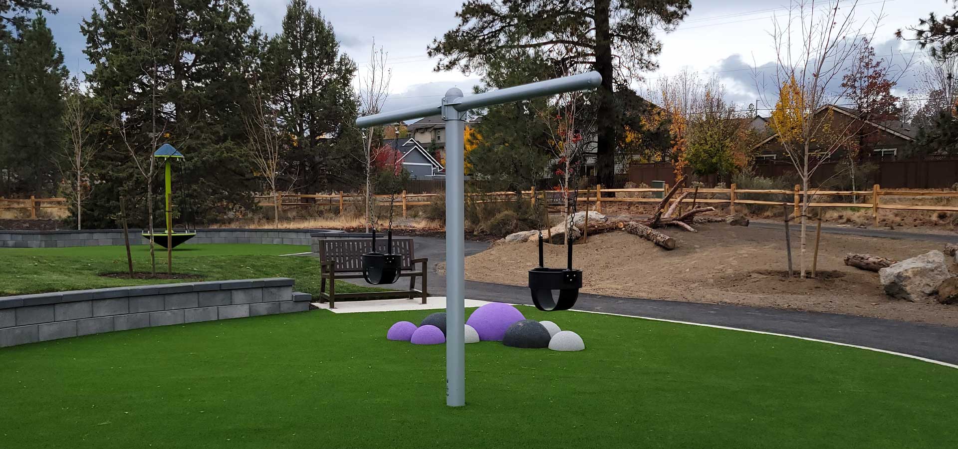 Photograph of swings and other play equuipment at Little Fawn Park.